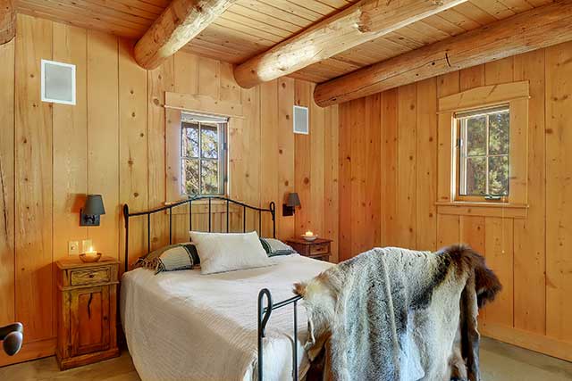 pine-paneled bedroom